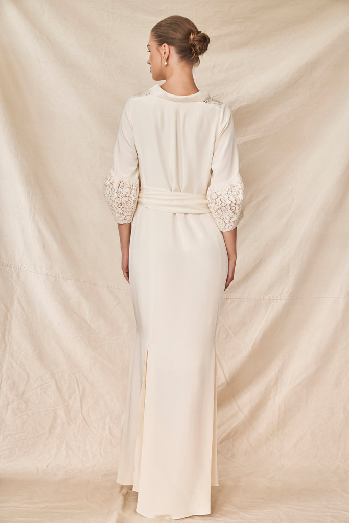 Bride wearing silk ivory modern wedding dress with lace collar and sleeves 