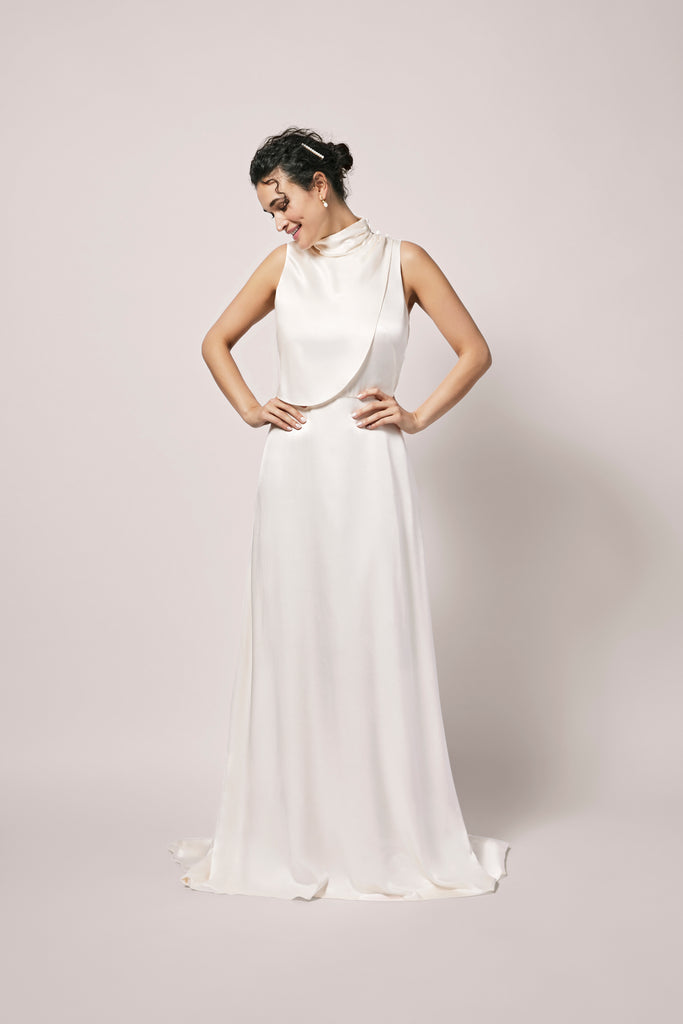 Woman wearing off-white satin modern wedding gown