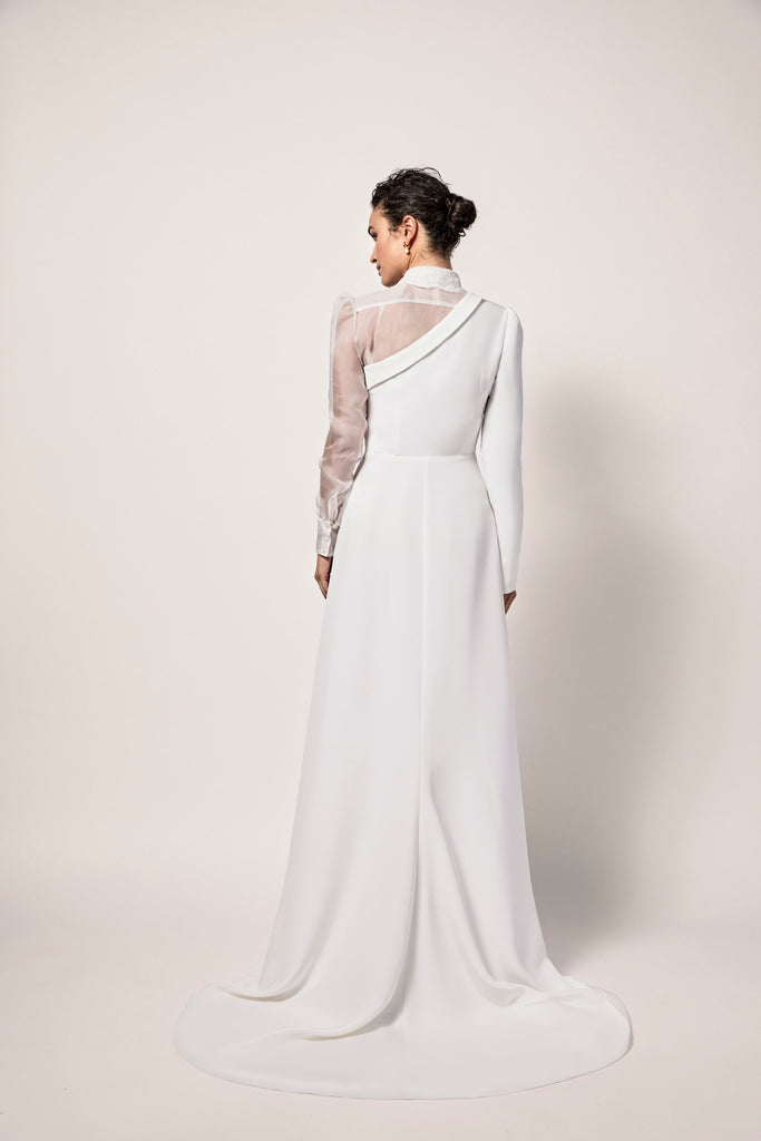 Woman wearing ivory one sleeve silk wedding dress 