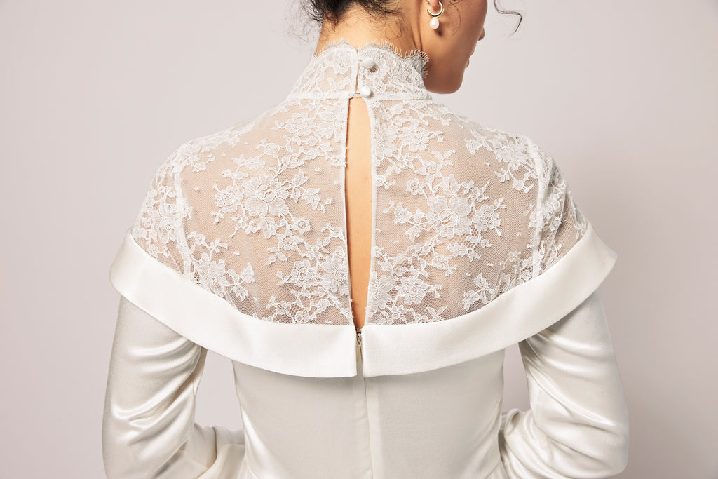 Woman wearing off-white silk charmeuse bridal shirt dress back view
