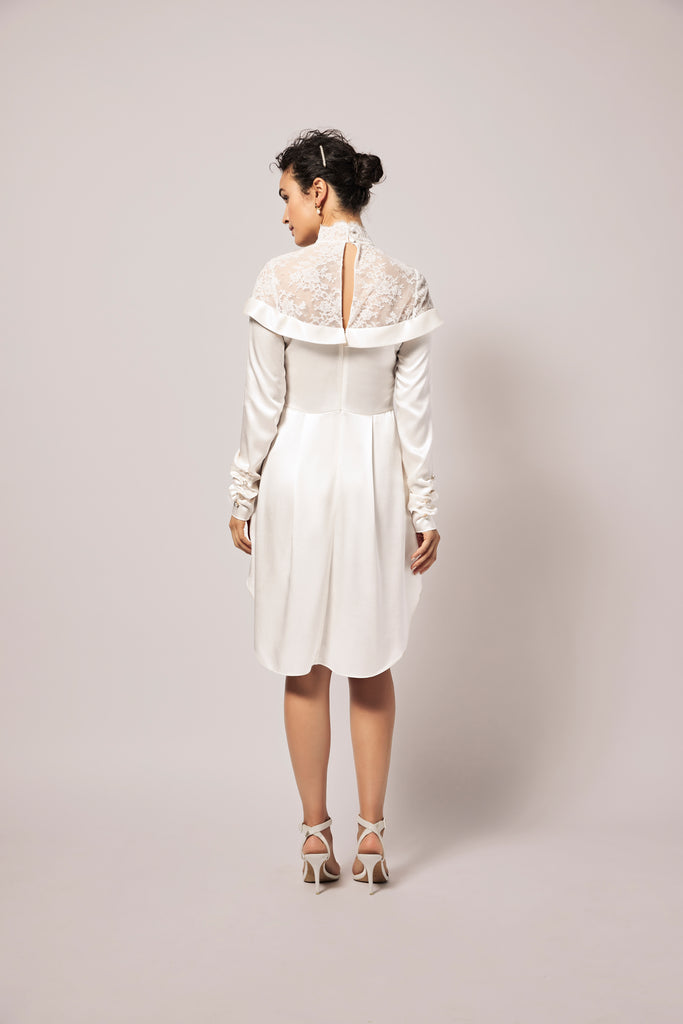 Woman wearing off-white silk charmeuse bridal shirt dress with long sleeves