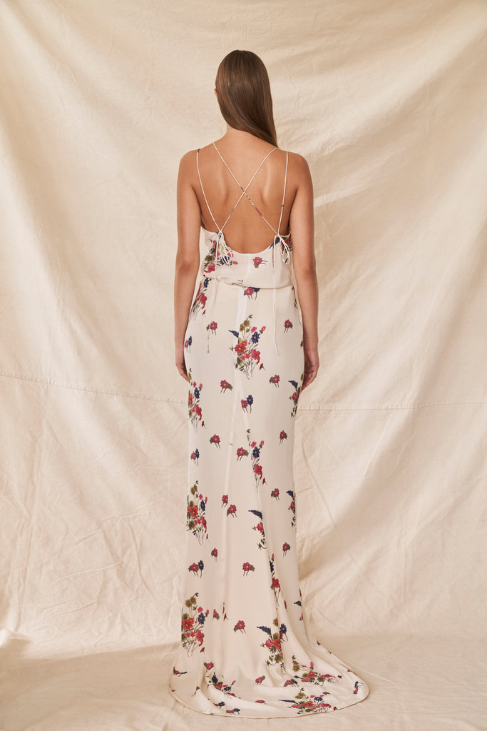 Woman wearing two piece wedding dress with silk floral cami and chiffon skirt back view